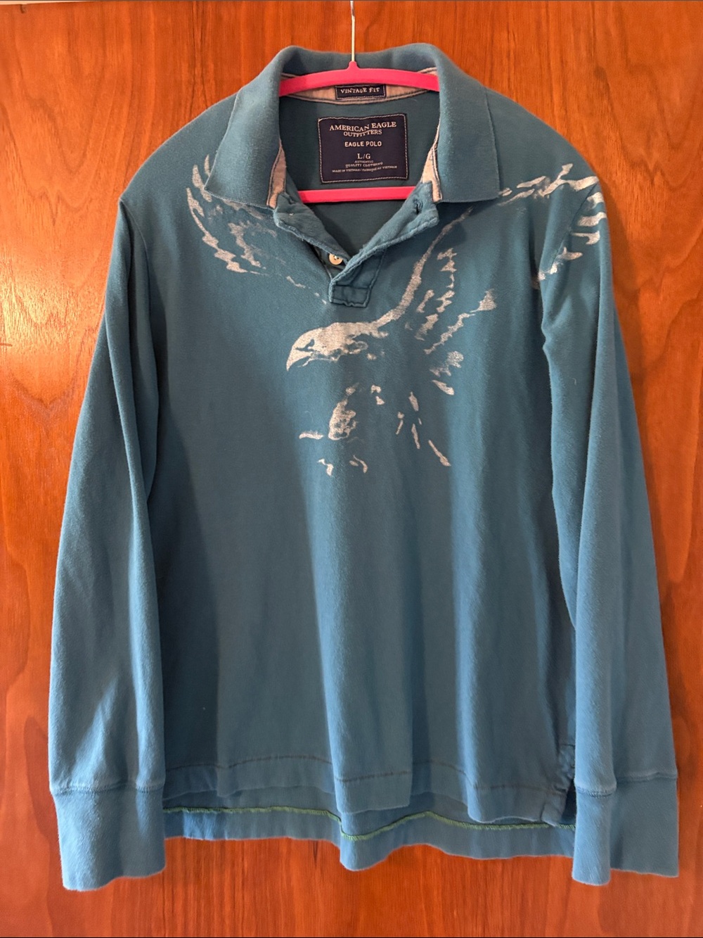 American Eagle Outfitters Men’s Teal Long-Sleeve Polo with White Eagle Graphic